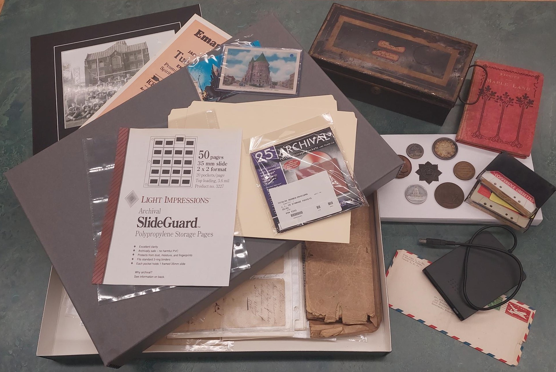 historic items and archival preservation supplies fanned out on a tabletop