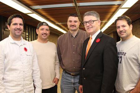 photo of five library staff members bearing mustaches