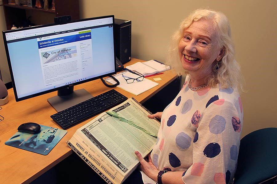 Leddy librarian Katharine Ball consults an online archive making accessible more than 100 years of the Windsor City Directory.
