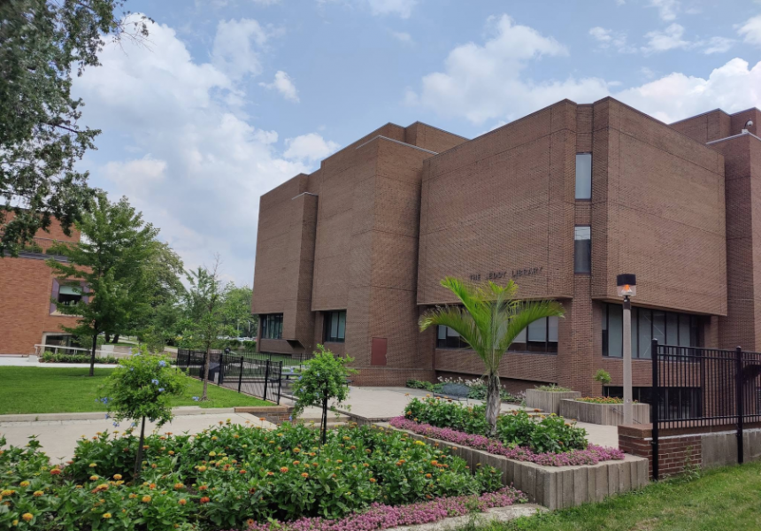 Leddy Library Building exterior brown brick and green landscaping.
