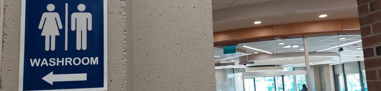 Washroom sign and view of collaboratory space