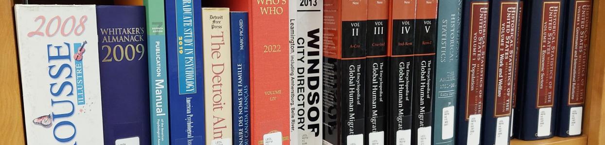 Row of reference books on a shelf